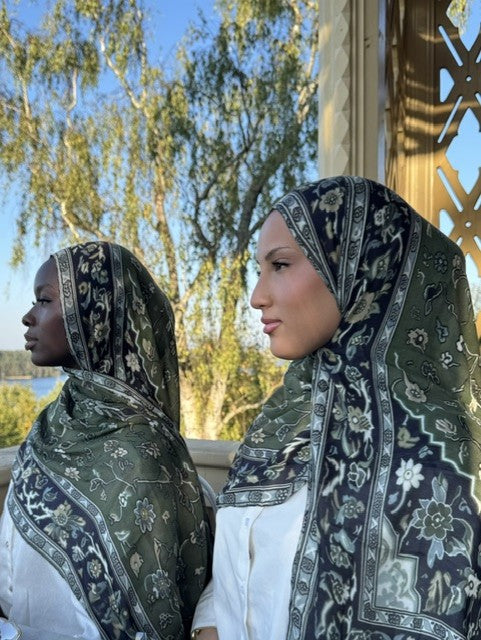 Two women in printed modal hijabs by a lake